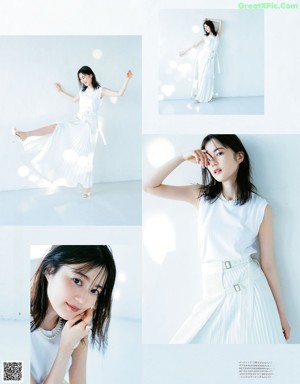 A woman laying on the floor in a white shirt and blue skirt.