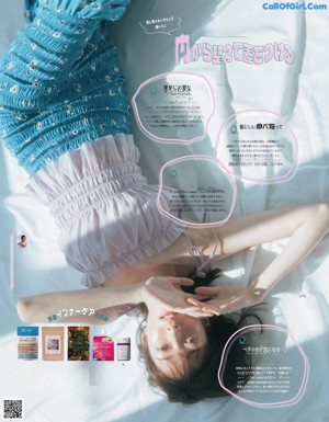 A woman with long brown hair and bangs on a magazine cover.