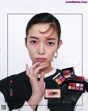 A magazine page with a picture of a woman with makeup.